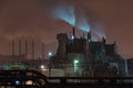 Power station with steam cloud blown by the wind Royalty Free Stock Photo