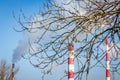 The power station with three smoke stacks in the background Royalty Free Stock Photo