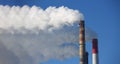 Power station with three smoke stacks, smoking pipes of heating supplying heat to city