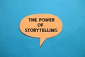 The power of storytelling, text words typography written on paper against blue background, life and business motivational