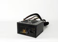 Power supply Black box with wires on a white background. Royalty Free Stock Photo