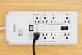 A power surge protector on wood Royalty Free Stock Photo