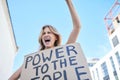 Power to the people, sign and woman protest human rights freedom, justice and democracy in city social rally. Feminist Royalty Free Stock Photo