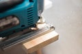 Power tool. Image of electric fretsaw in action. Machine saw with a fine blade