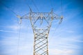 Power tower and transmission lines on blue background Royalty Free Stock Photo