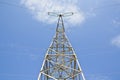 Power tower and transmission lines on blue background Royalty Free Stock Photo