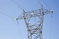 Power tower and transmission lines on blue background Royalty Free Stock Photo