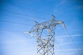 Power tower and transmission lines on blue background Royalty Free Stock Photo