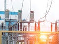 Power transformer in high voltage switchyard in modern electric substation, power station and sunset Royalty Free Stock Photo