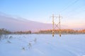 Power transmission line in winter snowy day. Electricity transportation Royalty Free Stock Photo