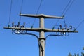 Power transmission masts against a blue sky