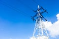 power transmission pole against the blue sky Royalty Free Stock Photo
