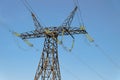 Power Transmission Tower. Air hi-voltage electric line supports on a blue sky background. Royalty Free Stock Photo