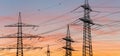 Power transmission tower silhouetted against the sunset Royalty Free Stock Photo