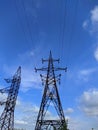 power transmission towers against the blue sky background Royalty Free Stock Photo