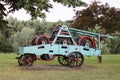 Power unit with wheels, flywheels and chain. Agricultural mechanism for harvest processing. Heavy engineering. Metal construction. Royalty Free Stock Photo