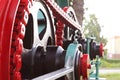 Power unit with wheels, flywheels and chain. Agricultural mechanism for harvest processing. Heavy engineering. Metal construction. Royalty Free Stock Photo