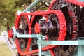 Power unit with wheels, flywheels and chain. Agricultural mechanism for harvest processing. Heavy engineering. Metal construction. Royalty Free Stock Photo