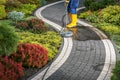 Power Washing Residential Garden Pathway Using Concrete Surface Attachment Royalty Free Stock Photo