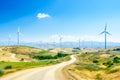 Power of wind turbine generating electricity clean energy on beautiful landscape background Royalty Free Stock Photo