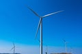 .Power of wind turbine generating electricity clean energy with cloud background on the blue sky.Global ecology.Clean energy Royalty Free Stock Photo