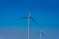 Power of wind turbine generating electricity clean energy with cloud background on the blue sky.Global ecology.Clean energy Royalty Free Stock Photo