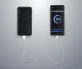 Powerbank charging a black smartphone on white background