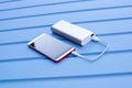 Powerbank charging smartphone Royalty Free Stock Photo