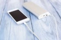 Powerbank charging white smartphone