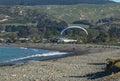 Powered hang glider in use over beach in Hawkes Bay Royalty Free Stock Photo