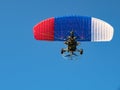 Powered parachute against the blue sky. Royalty Free Stock Photo