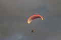 Powered parachute against the dark clouds