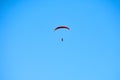 Powered parachute in clear blue sky, motorized parachute overhead view, extreme tourism copy space