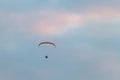 Powered paragliding, man flying high in a sky with parachute and engine on his back Royalty Free Stock Photo