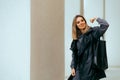 Strong Woman Holding a Shopping Bag Flexing Muscles