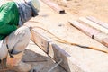 skilled laborer performing intense shielded metal arc welding (SMAW) on a metal structure at a construction or Royalty Free Stock Photo