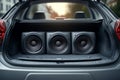 Powerful audio system installed in a car trunk showing subwoofers Royalty Free Stock Photo