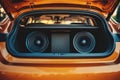 Powerful audio system installed in a car trunk showing subwoofers Royalty Free Stock Photo
