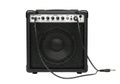 Powerful black guitar amplifier with cables ready for rock music performance Royalty Free Stock Photo