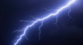 Powerful blue lightning bolt strikes during a dramatic thunderstorm illuminating the night sky Royalty Free Stock Photo