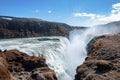 Powerful cascades of Gullfoss waterfall in scenic Golden Circle against blue sky Royalty Free Stock Photo