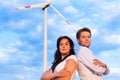 Powerful couple in front of windmill
