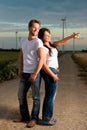 Powerful couple in front of windmill