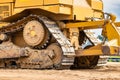 Powerful crawler bulldozer close-up at the construction site. Construction equipment for moving large volumes of soil. Modern