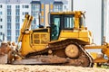 Powerful crawler bulldozer close-up at the construction site. Construction equipment for moving large volumes of soil. Modern Royalty Free Stock Photo