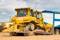 Powerful crawler bulldozer close-up at the construction site. Construction equipment for moving large volumes of soil. Modern Royalty Free Stock Photo