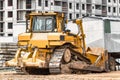 Powerful crawler bulldozer close-up at the construction site. Construction equipment for moving large volumes of soil. Modern Royalty Free Stock Photo