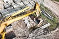 A powerful crawler excavator is working on a construction site. Close-up. View from above. Preparation of a pit for construction. Royalty Free Stock Photo