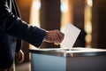 Male hand putting voting paper in the ballot box. Election concept. Ai generative