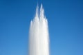 Powerful discharge of water fountain, geyser against the blue sky.